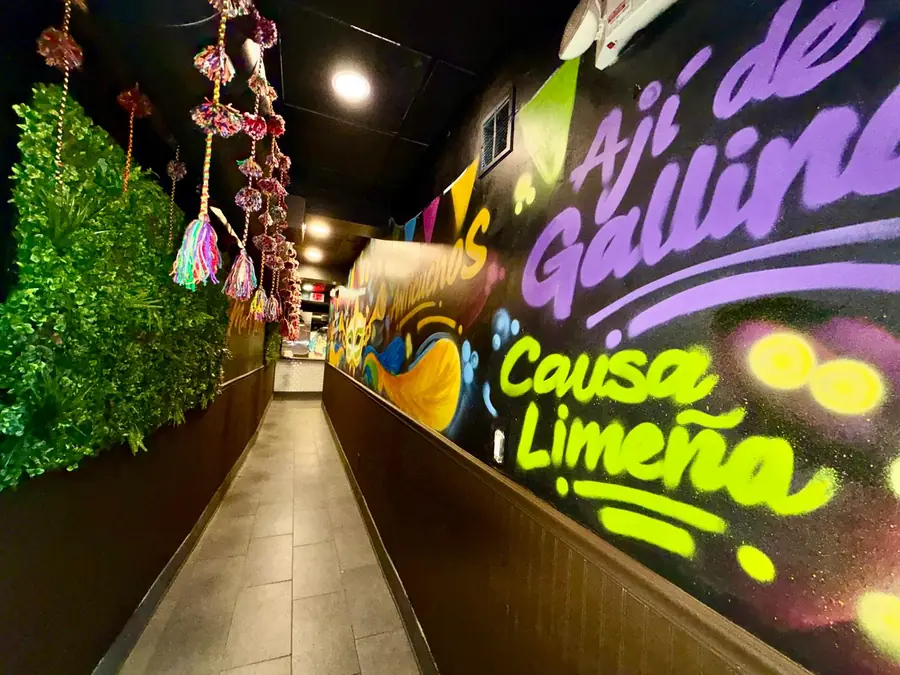 Hallway with Ají de Gallina and Causa Limeña lettering
