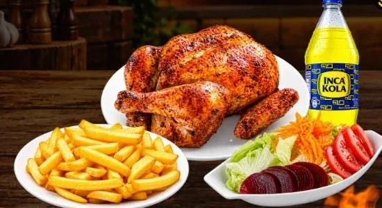 Pollo a la brasa with french fries, salad and Inca Kola